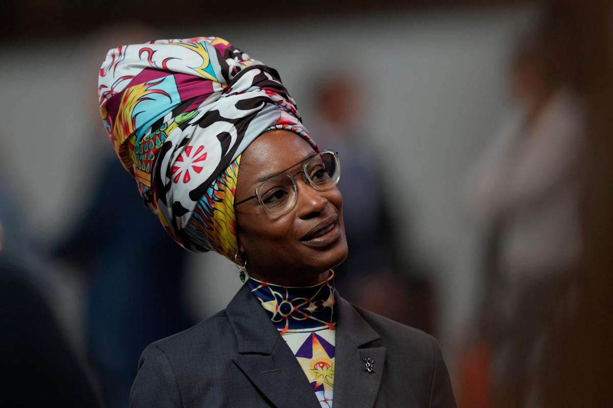 A portrait of Sylvana Simons arriving "for a ceremony where Dutch King Willem-Alexander marked the opening of the parliamenta