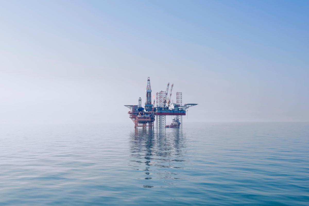 An offshore oil rig in the middle of the East China Sea. There does not appear to be land nearby in any direction.