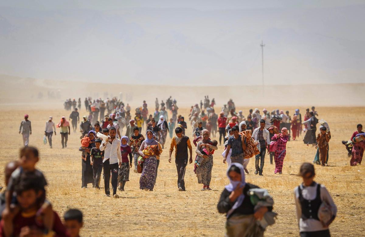 Thousands of Yazidis trapped in the Sinjar mountains as they tried to escape from Islamic State (IS) forces, are rescued by K