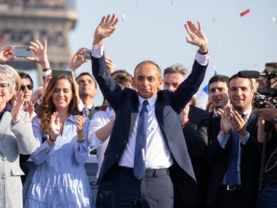 "Eric Zemmour surrounded by supporters at the end of his meeting at the Trocadero on March 27, 2022."