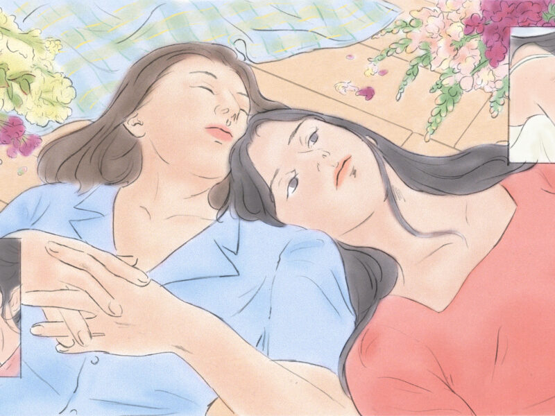 An illustration of two friends lying on the floor, one wearing a light blue, short sleeved collared shirt, her hands clasped over her chest and her eyes closed; the other woman is wearing a pink blouse and is leaning on her shoulder, looking up at the sky. Behind them there is a checkered blanket and bouquets of flowers. In two inserts, we see the woman in the pink shirt alone, clearly in pain and grieving.