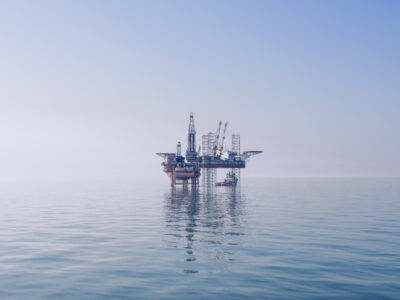An offshore oil rig in the middle of the East China Sea. There does not appear to be land nearby in any direction.