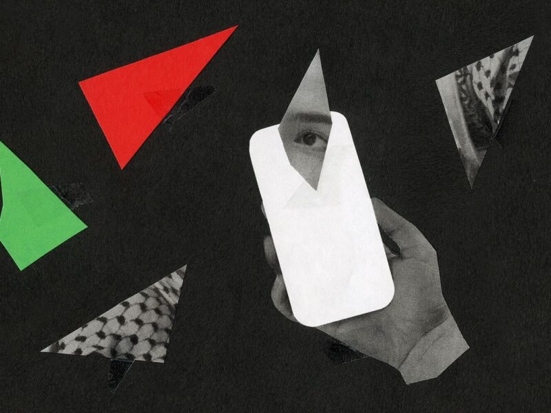A collage on a fuzzy black background, with a disembodied hand holding a white cutout in the shape of a phone. There are fractured pieces scattered over the image, including one green triangle, one red triangle, and two triangles that show pieces of a keffiyeh. There is a fractured shard of an eye layered over the phone.