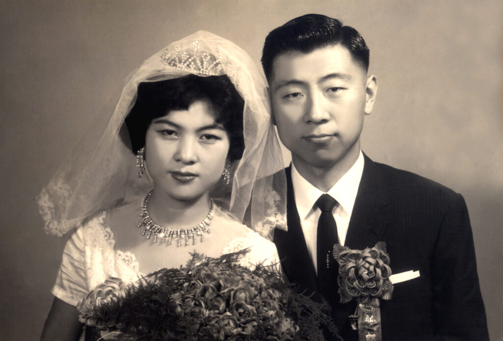 A sepia tone photo of the author's grandparents on their wedding day.