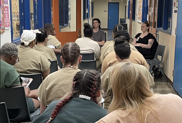 A photo of Julia Fox faciliating a creative writing workshop. 
