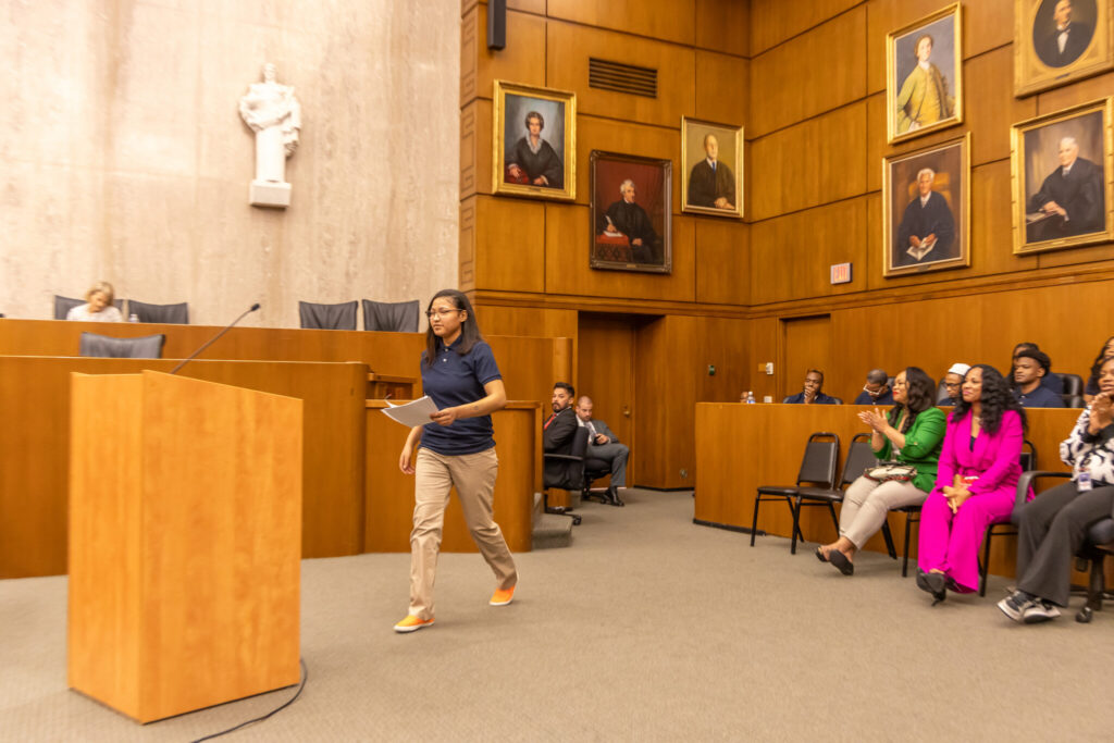 A photo of London Teeter walking to the stand to argue against mandatory minimum sentences.