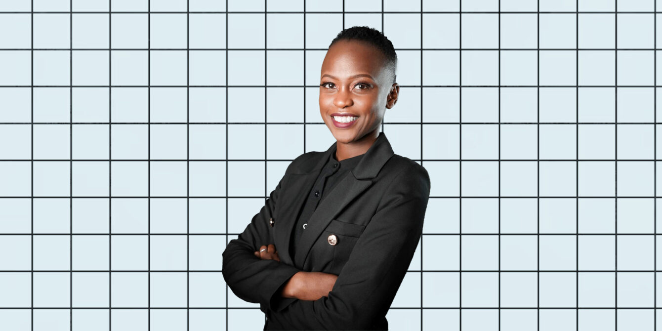 A portrait of Nerima Wako Ojiwa on a light blue grid background.