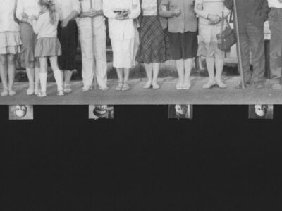A photograph of the Baltic Way protest in black and white over the smaller, upside-down portraits of various authoritarians on a black background.